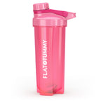 The Flat Tummy Co pink plastic shaker bottle has a matching screw-on lid and flip cap, ideal for mixing protein shakes. "FLAT TUMMY" is printed vertically in white on the side.