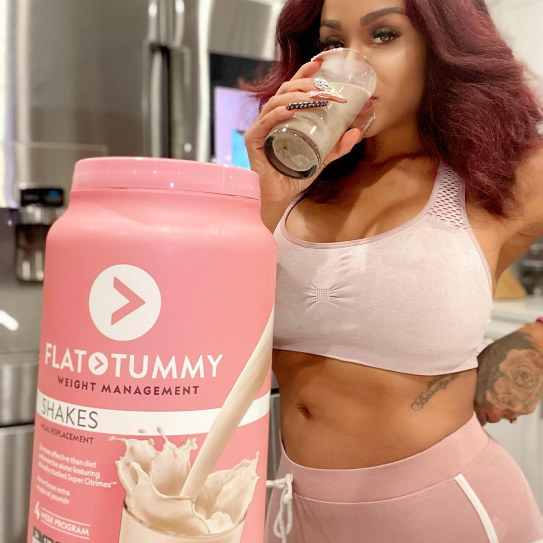 Woman drinking flat tummy shakes