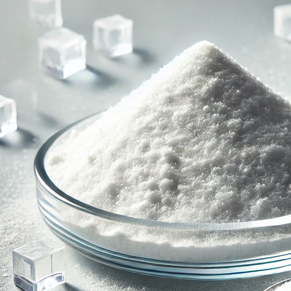 A glass bowl filled with a mound of granular white BHB salts. 