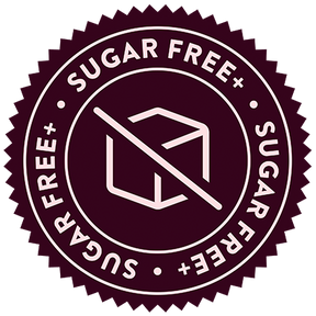 A circular badge with a scalloped edge. The design includes an icon of a sugar cube crossed by a diagonal line, symbolizing "sugar free," and the phrase "SUGAR FREE" encircles the border.