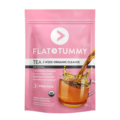 A pack of Flat Tummy Co's 14 Day Flat Tummy Tea, 2 Week Organic Cleanse, Original. The pink package features an image of a glass cup of tea with a splash effect and includes text highlighting detox benefits, metabolism support, and ways to reduce bloating. The product is labeled as a herbal supplement with a USDA Organic seal.