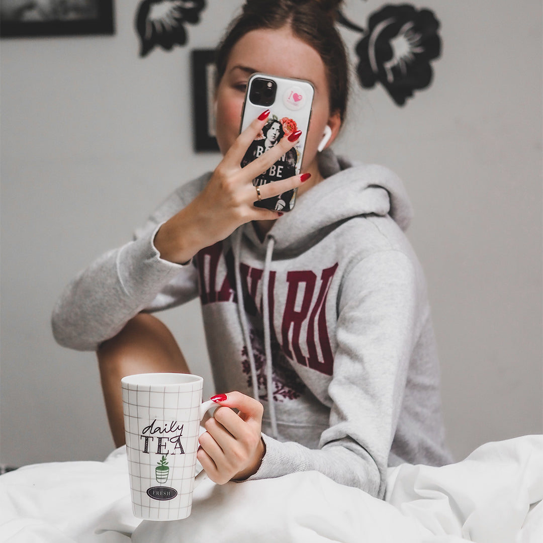 Woman on her phone in bed